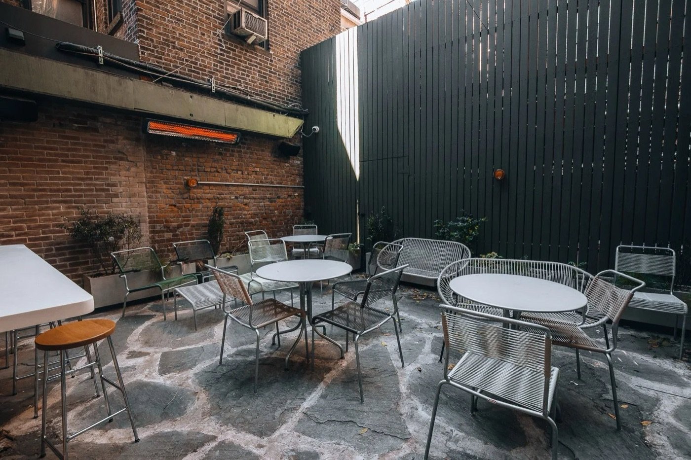 The empty heated backyard patio at Do Not Feed Alligators in the West Village